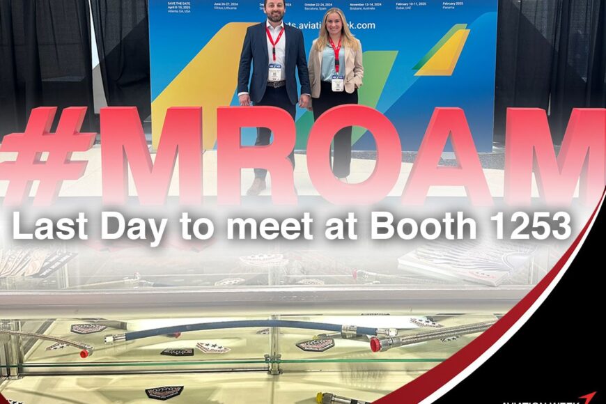 two individuals standing before a promotional banner at the mro americas event, with text "auto draft" and model airplanes displayed in the foreground.