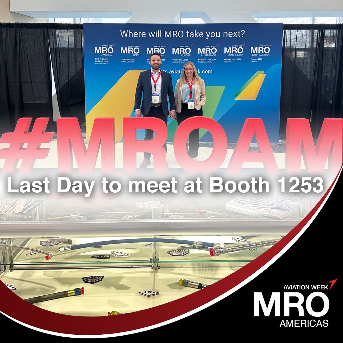 two individuals standing before a promotional banner at the mro americas event, with text "auto draft" and model airplanes displayed in the foreground.
