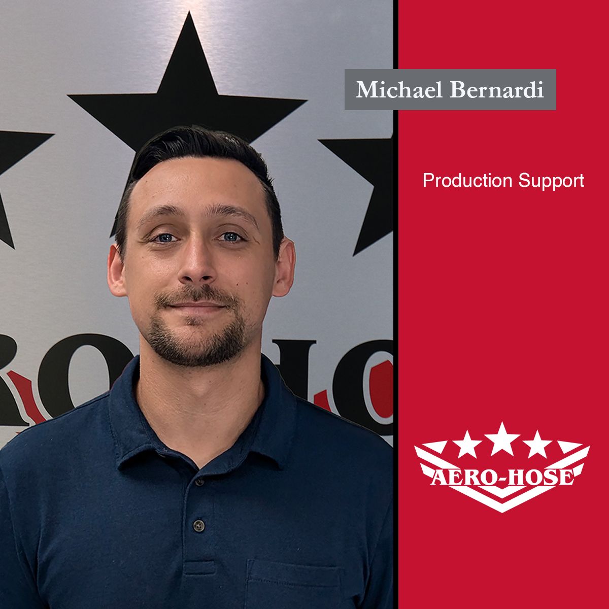 A man with short dark hair stands in front of a wall adorned with black stars and the Aero-Hose logo. The text reads "Michael Bernardi, Production Support, Auto Draft Specialist.